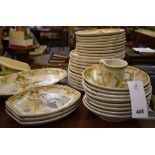 A quantity of Quimper 'Keraluc' dinnerware, enamelled stoneware decorated with yellow and brown