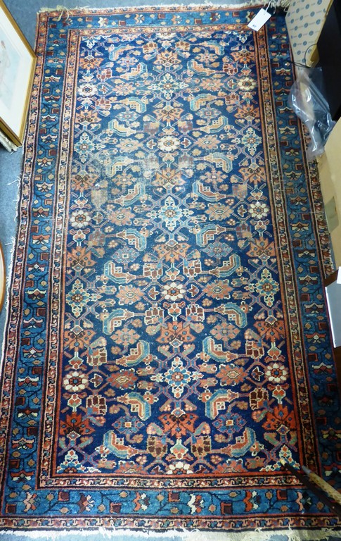 A Caucasian rug, blue floral field.