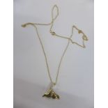 A 14ct gold and diamond whale-tail pendant on chain,