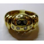 An 18ct gold and diamond bombe ring