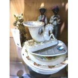 A pair of antique black jazz band ceramic figurines, together with a Belleek sea horse posy vase;