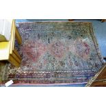 A small antique Turkoman rug, worn.