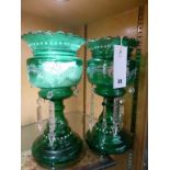 A pair of Victorian green glass lustres.,