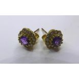 A pair of 18ct yellow gold, amethyst and diamond cluster stud earrings