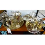 A large quantity of silverplate, to include Guernsey can; posy vases; tray; coffee pot; toastrack,