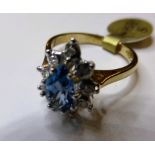 A 9ct gold, pear-shape topaz and diamond cluster ring