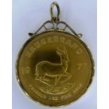 A 1977 gold full Krugerrand in 9ct gold pendant mount,