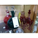 A pair of Victorian coloured glass flagons together with bohemian flashed glass etc (9)