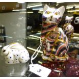 A Royal Crown Derby cat paperweight, together with a rabbit. (2)