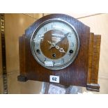 An Enfield Clock Co vintage oak cased mantle clock with Westminster chimes, with pendulum.