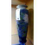 A Royal Doulton vase, rose pattern on blue glaze.