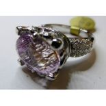 An 18ct white gold, Kunzite and diamond ring (size M)