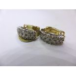 A pair of 14ct gold and diamond two row hoop earrings,