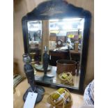 A bevelled glass ebony mirror on stand plus French pewter lamp (2).