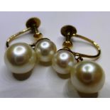 A pair of 9ct yellow gold and cultured pearl drop earrings, with cultured pearl above and baroque