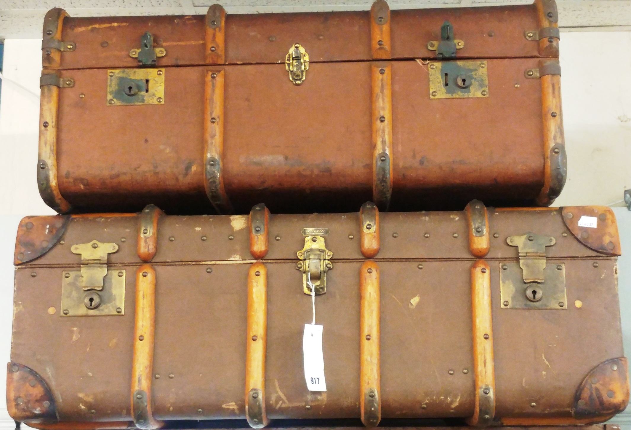 A pair of vintage canvas and wood travel trunks with lift out trays (2)