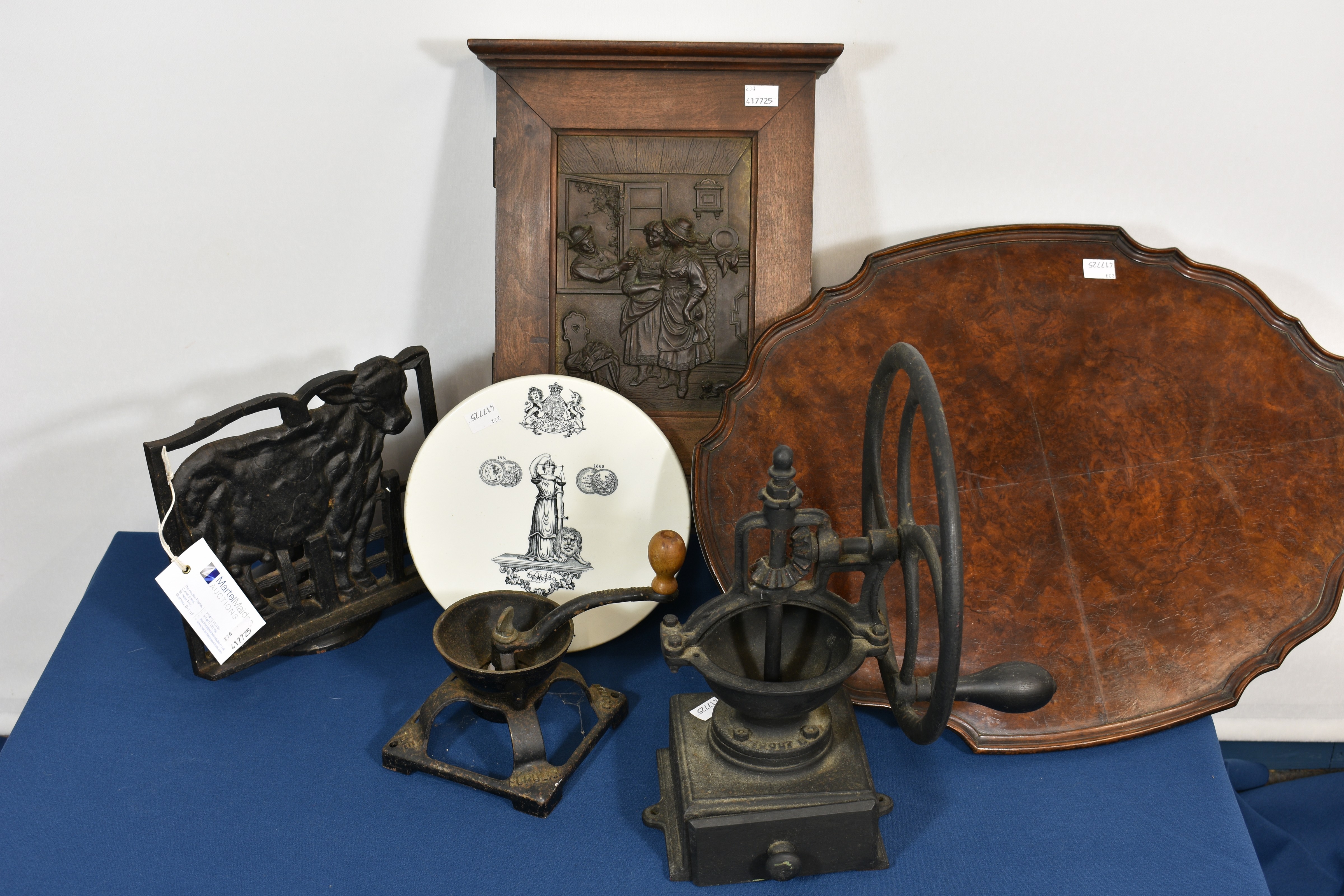 A cast iron Beatrice coffee grinder plus another together with a cast iron recipe book stand, wooden