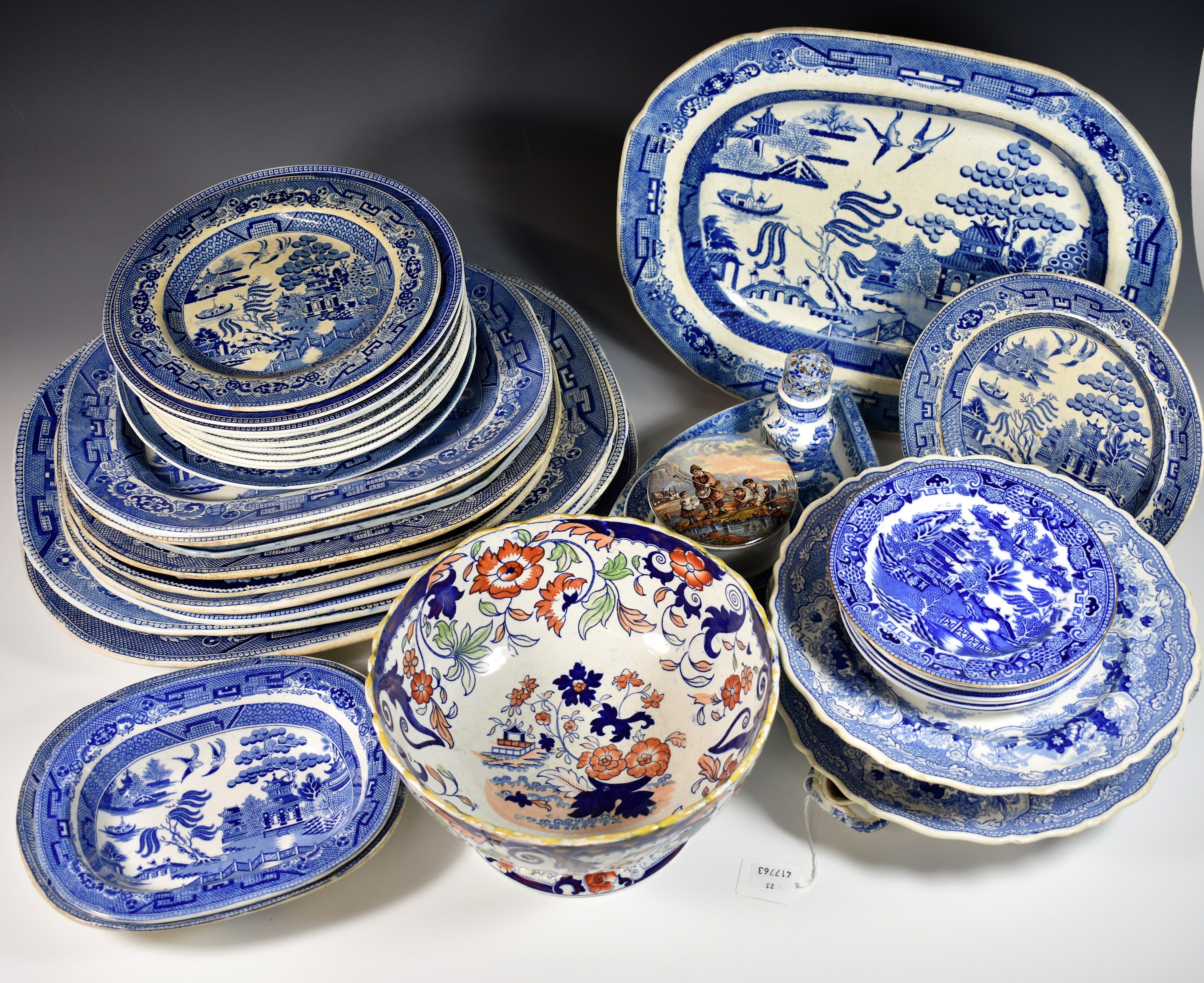 A collection of blue and white, mostly Willow pattern, plus two Minton Sicilian pattern plate