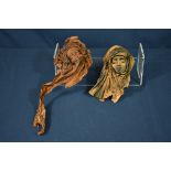 Two very unusual stretched and dried chamois leather face masks probably mid-century.