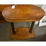 A Continental sycamore and ebonised centre table late 19th century, the rounded oblong top