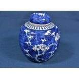 A Chinese porcelain blue and white lidded ginger jar of ovoid form with prunus blossom decoration