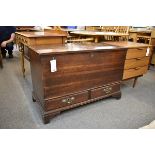 A small mid-18th century oak mule chest the plain, two plank top with applied square edge