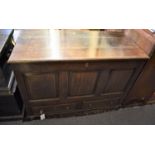 A mid 18th century oak mule chest with hinged three plank lid over panelled front and sides and
