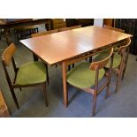 A mid twentieth century G Plan extending teak dining table and six matching chairs (7)
