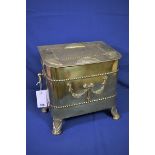 A Victorian brass coal box of rectangular form with rounded corners, hinged lid, applied