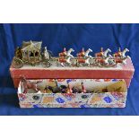 A Lesney Coronation Coach scale diecast model horse drawn coach comprising of a golden carriage with