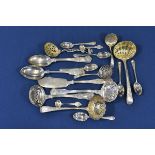 A small collection of silver cutlery comprising of seven sifter spoons to include a bright cut