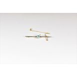 A mid-century 15ct gold, platinum, zircon and diamond bar brooch the 6mm. round cut zircon flanked