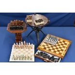 A collection of five chess sets from Africa and South America.