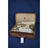 A large collection of various tea and cigarette cards contained in vintage brown leather suit