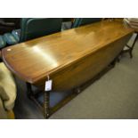 A reproduction oak gate leg dining table, oval top with two drawers on square stretcher, 196cm x