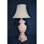 A pink & white pottery table lamp standing 25in. (63.5cm.) to top of light fitting.