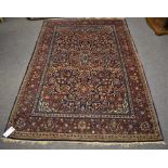 A good Kashan rug second quarter 20th century, dark blue field with central madder floral pendant