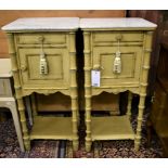 A pair of marble top bedside tables, 20th century, each with single drawer and cupboard, faux bamboo