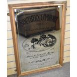 A Southern Comfort advertising mirror decorated with a paddleboat scene