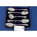 A cased set of George III silver berry spoons