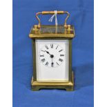 A single train French brass carriage clock 4 1/4in. (10.8cm.) high without handle.