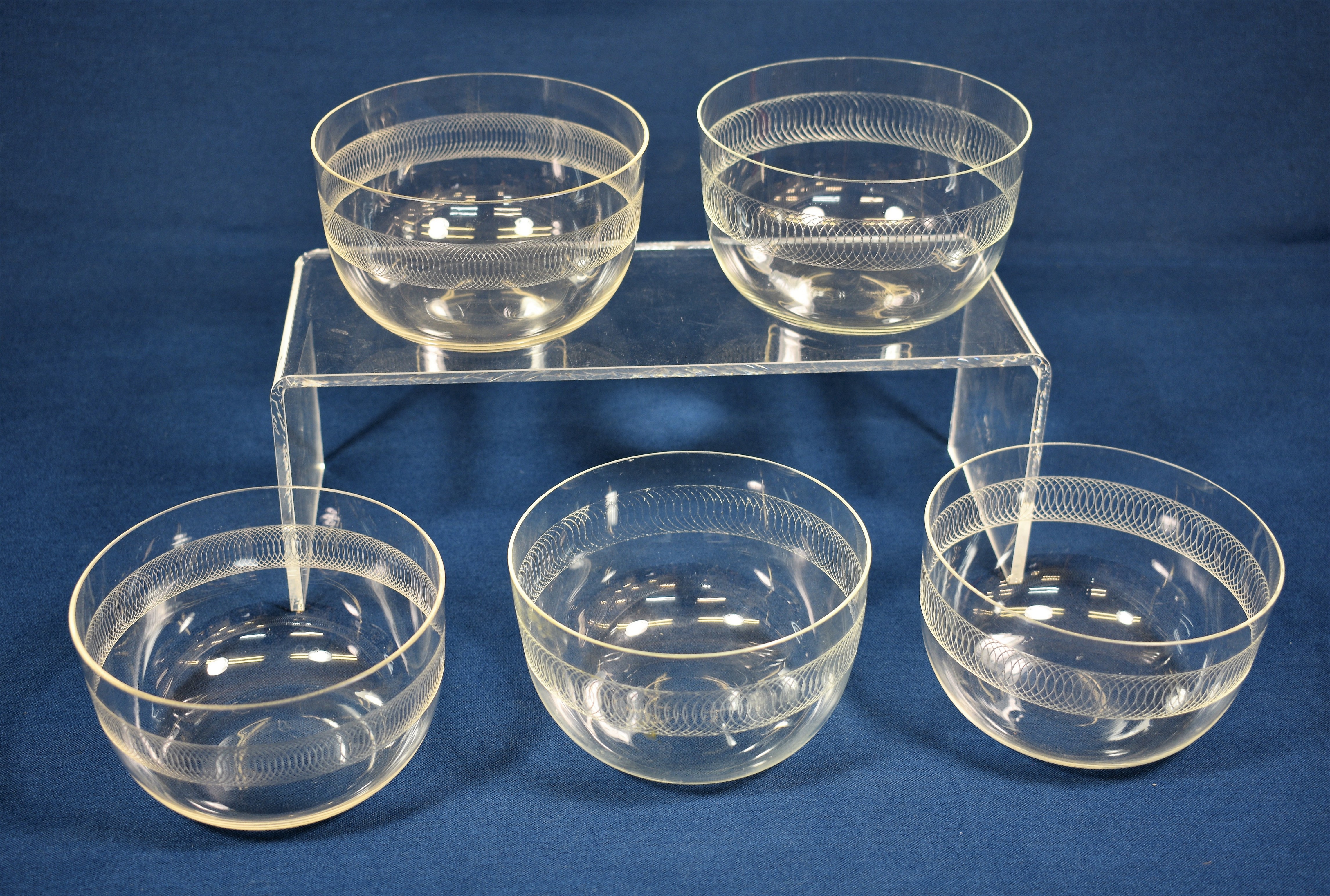 A closely matched set of five Edwardian etched glass finger bowls
