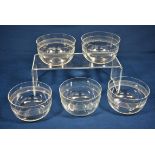 A closely matched set of five Edwardian etched glass finger bowls