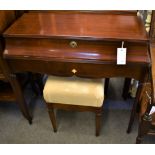 A French cherrywood dressing table with hinged top and fitted interior, together with a matching