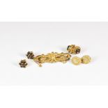 A late Victorian 9ct gold brooch together with three pairs on yellow gold stud earrings, one set