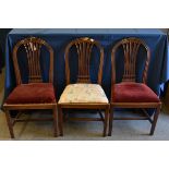 Three George III mahogany dining chairs in the Hepplewhite style, C.1800