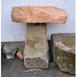 A large pink granite mushroom approximate height, 30in. (76.2cm.)