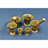 Six antique bronze pestle and mortar of varying sizes and gauges.