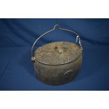 A Kenrick & Sons of West Bromwich cast iron cooking pot with cover; together with a cast iron