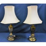 A pair of brass urn shaped table lamps with cream shades (2)
